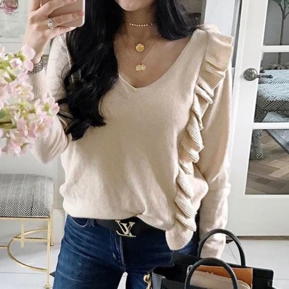 Elizabeth and James Odell ruffle sweater